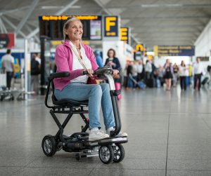 TryB4ufly at the Mobility Roadshow - lady on a scooter at the airport