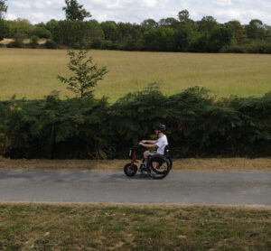 Dominic driving past the camera